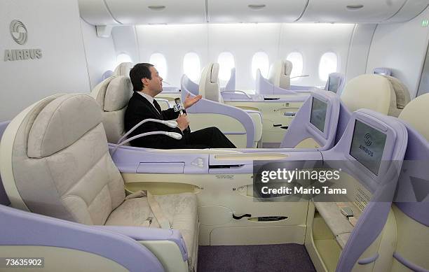 Reporter sits in a first-class seat of the new double-decker Lufthansa Airbus A380 after it arrived at JFK International Airport following its first...