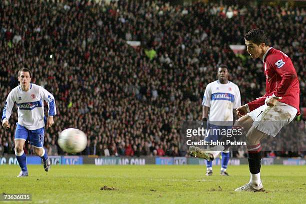 Cristiano Ronaldo of Manchester United scores the first goal during the FA Cup Sponsored by E.ON Quarter-Final Replay match between Manchester United...