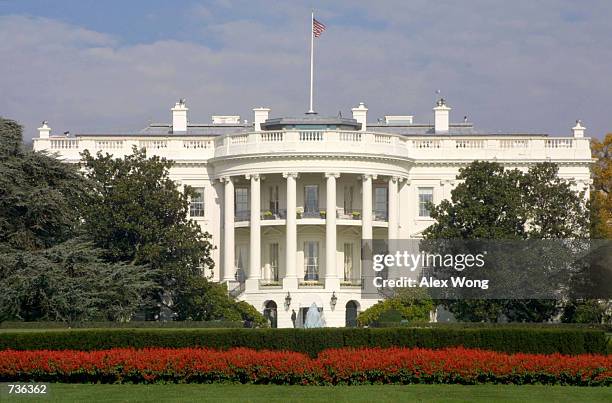 Flag flies atop the White House November 15, 2000 in Washington, DC. It has been reported February 7, 2001 that a man, identified as a 17 year old...