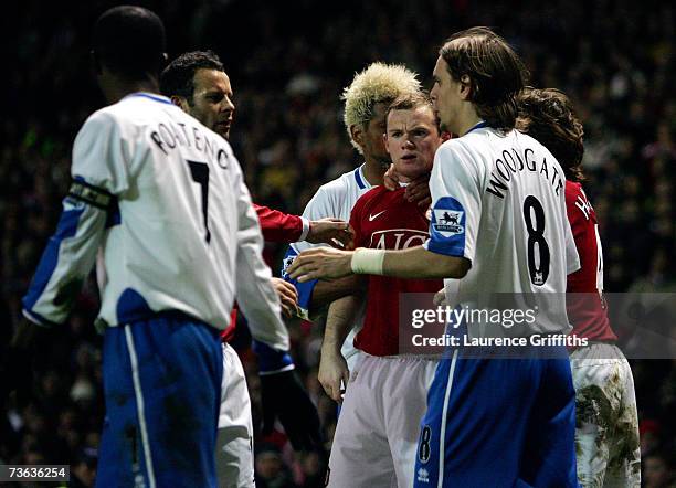 Wayne Rooney of Manchester United is pulled away from George Boateng of Middlesbrough after Lee Catermole is sent off during the FA Cup sponsored by...