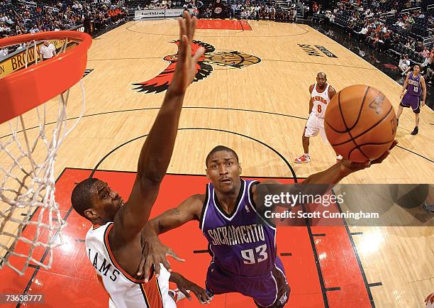 Ron Artest of the Sacramento Kings drives to the basket against Marvin Williams of the Atlanta Hawks at Philips Arena on March 19, 2007 in Atlanta,...