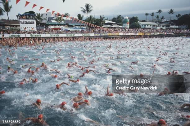 Competitors race ointo the sea at the start of the Gatorade IronmanTriathlon on 19 October 1991 on Kona, Hawaii, United States. Visions of Sport.