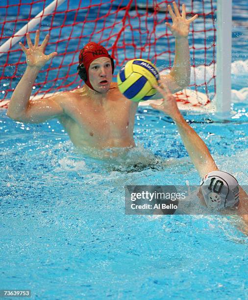 John Love of New Zealand attempts to save a shot from Peter Biros of Hungary in Men's Preliminary Round Group D Water Polo match between Hungary and...