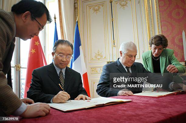 China's first deputy Foreign Minister Dai Bingguo and French Justice Minister Pascal Clement , sign a groundbreaking extradition treaty, 20 March...