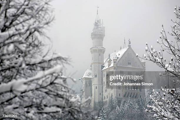 Snow covers the "fairy tale" Neuschwanstein Castle on March 20, 2007 near Fussen , Germany. Following a spell of warm weather, temperatures dropped...