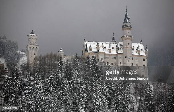 Snow covers the "fairy tale" Neuschwanstein Castle on March 20, 2007 near Fussen , Germany. Following a spell of warm weather, temperatures dropped...