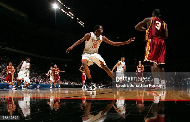 Kevin Durant of the Texas Longhorns defends against Lodrick Stewart of the USC Trojans during the second round of the NCAA Men's Basketball...