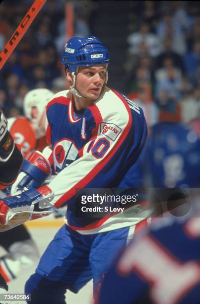 Canadian professional ice hockey player Dale Hawerchuk of the Winnipeg Jets skates on the ice during a game against the Philadelphia Flyers, the...