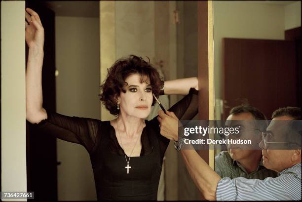 French actress Fanny Ardant photographed for a feature in the French magazine, Marie-Claire, standing in a shower of a luxury bathroom of a hotel on...
