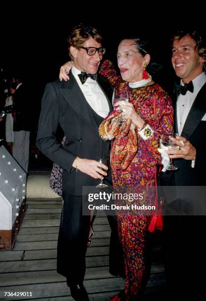 French fashion designer Yves Saint Laurent at a launch party for his Opium perfume line with the American fashion editor Diana Vreeland in 1981.