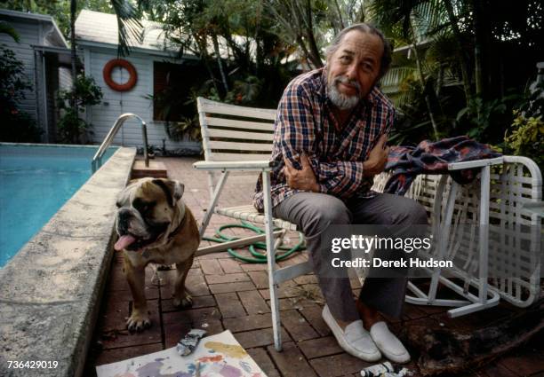 American playwright Tennessee Williams in the swimming pool at the house he owned in Key West shortly before his death.