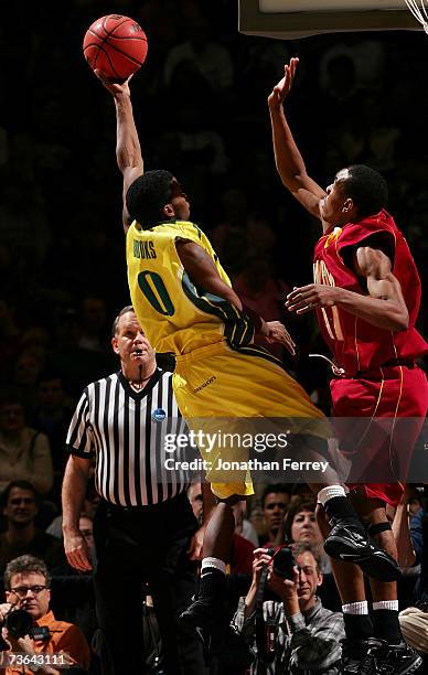 Aaron Brooks of the Oregon Ducks lays up a shot against the Winthrop Eagles during the second round of the NCAA Men's Basketball Tournament at...