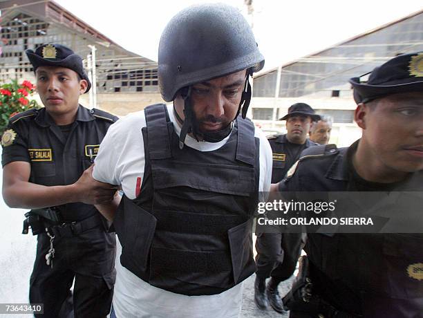 Agentes de la Policia Nacional Civil llevan arrestado en Ciudad de Guatemala a Carlos Amilcar Orellana, despues de haber sido arrestado en el...