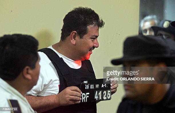 Agentes de la Policia Nacional Civil proceden a registrar en Ciudad de Guatemala a Carlos Amilcar Orellana, despues de haber sido arrestado en el...