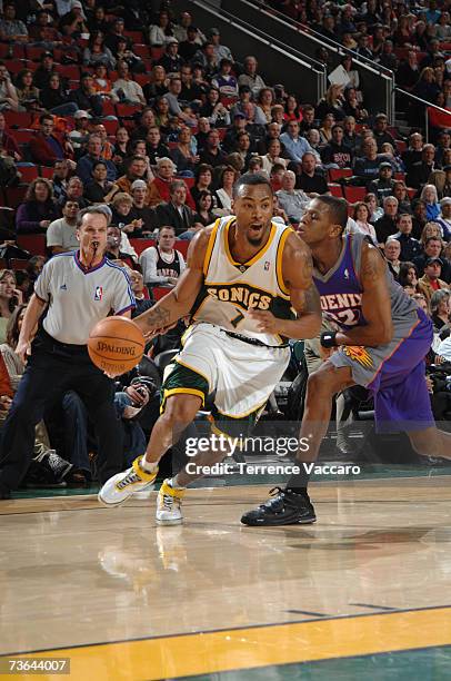 Rashard Lewis of the Seattle SuperSonics drives to the basket past James Jones of the Phoenix Suns during a game at Key Arena on February 14, 2007 in...