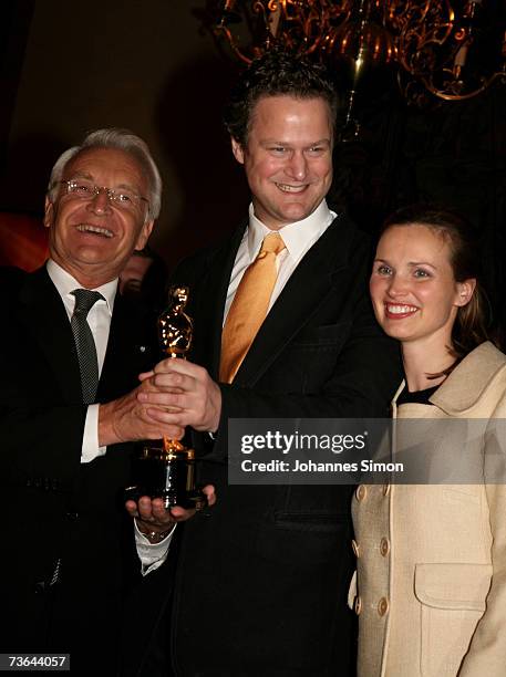 German director and Oscar winner Florian Henckel von Donnersmarck , his wife Christiane and Bavarian state governor Edmund Stoiber pose with the...
