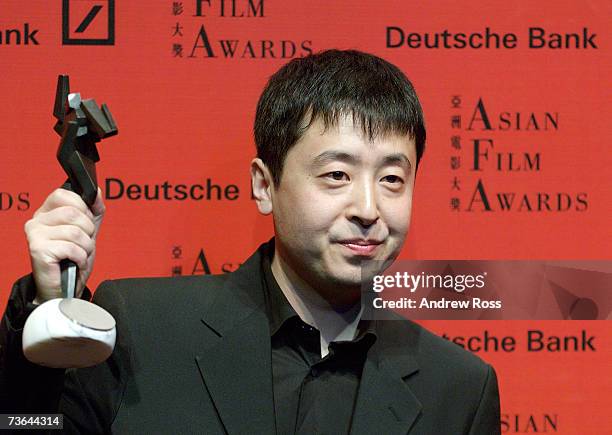 Chinese Director Jia Zhangke receives the award for Best Director at the Asian Film Awards as part of the Hong Kong International Film Festival 2007...