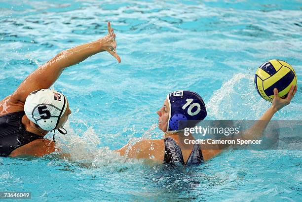 Marina Gritsenko of Kazakhstan is defended by Lauren Wenger of the United States in the Women's Preliminary Round Group C Water Polo match between...