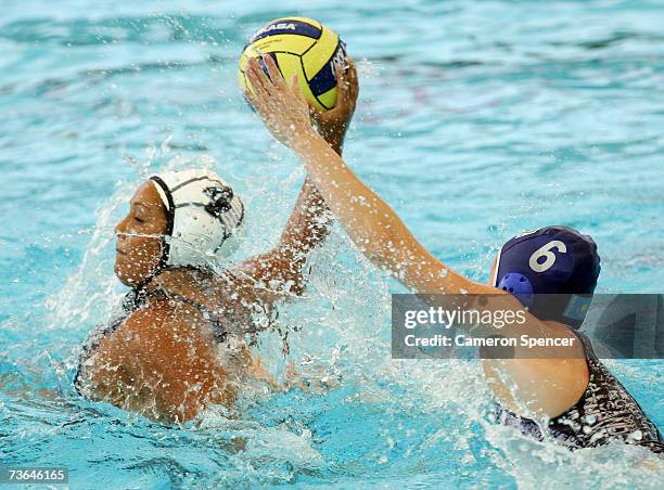 Anna Zubkova of Kazakhstan defends against Brenda Villa of the United States in the Women's Preliminary Round Group C Water Polo match between the...