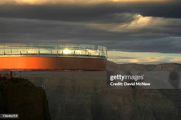 The sun sets on the evening of the first official walk on the Skywalk, billed as the first-ever cantilever-shaped glass walkway extending 70 feet...