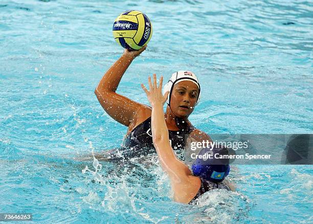 Brenda Villa of the United States looks to pass the ball as Anna Zubkova of Kazakhstan defends in the Women's Preliminary Round Group C Water Polo...