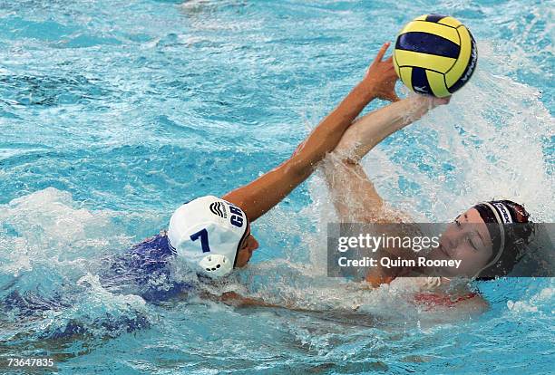 Aikaterini Oikonomopoulou of Greece defends against Iefke Van Belkum of Holland in the Women's Preliminary Round Group C Water Polo match between...