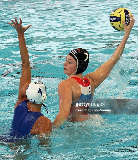 Aikaterini Oikonomopoulou of Greece defends against Iefke Van Belkum of Holland in the Women's Preliminary Round Group C Water Polo match between...