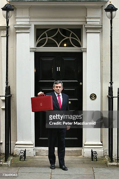 Chancellor of the Exchequer Gordon Brown holds his ministerial red box as he leaves for Parliament to present his 11th budget statement on March 21,...