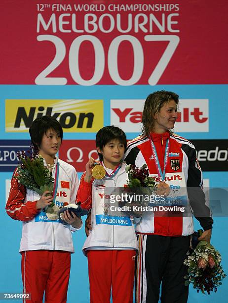 Christin Steuer of Germany, Wang Xin of China and Chen Ruolin of China pose with their medals after the Women's 10m Platform Final during the XII...