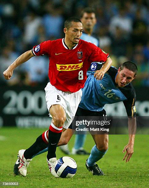 Shinji Ono of the Urawa Reds gets away from Mark Milligan of Sydney FC during the Asian Champions League match between Sydney FC and the Urawa Reds...