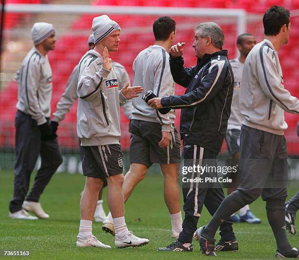 Andy Johnson speaks with Assistant coach, Terry Venables during the England training session at Wembley Stadium on March 21, 2007 in London, England.