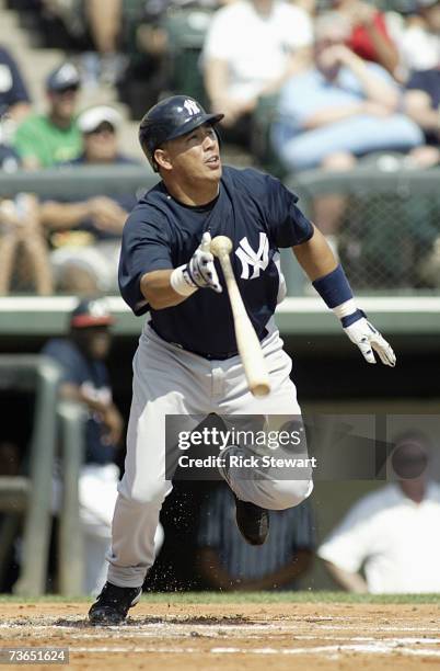 Angel Chavez of the New York Yankees follows his hit during a Spring Training game against the Atlanta Braves on March 8, 2007 at The Ballpark at...