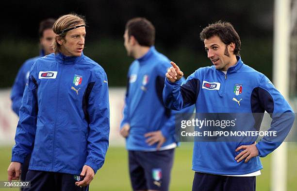 Italy's Alex Del Piero chats with Massimo Ambrosini during the afternoon training session at the National Technical Center of Coverciano in Florence,...