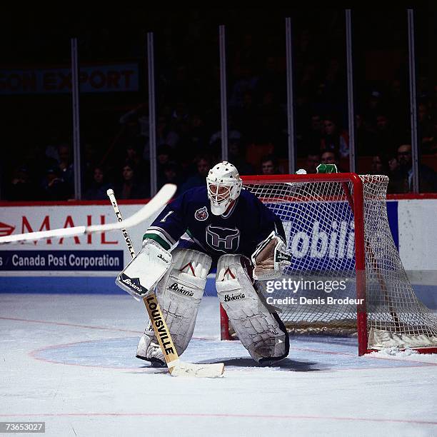 Goaltender Sean Burke of the Hartford Whalers prepares to defend the netagainst the Montreal Canadiens.