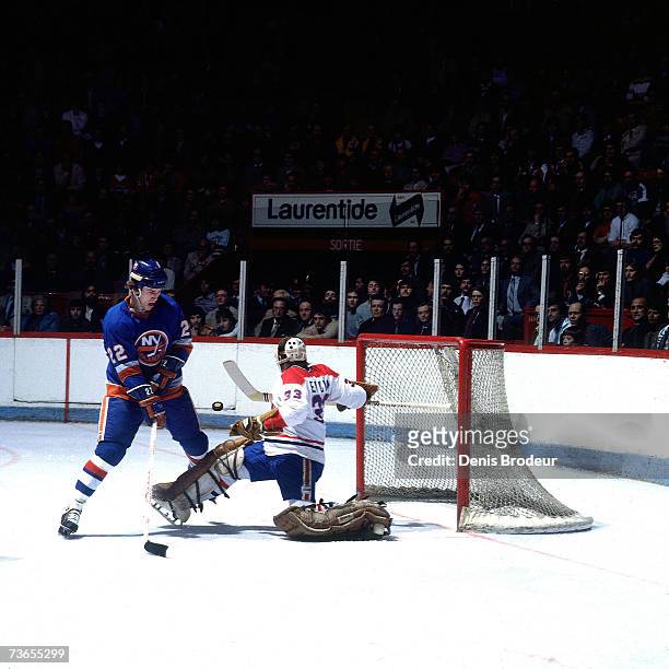 Goaltender Richard Sevigny of the Montreal Canadiens makes a save against Mike Bossy of the New York Islanders.