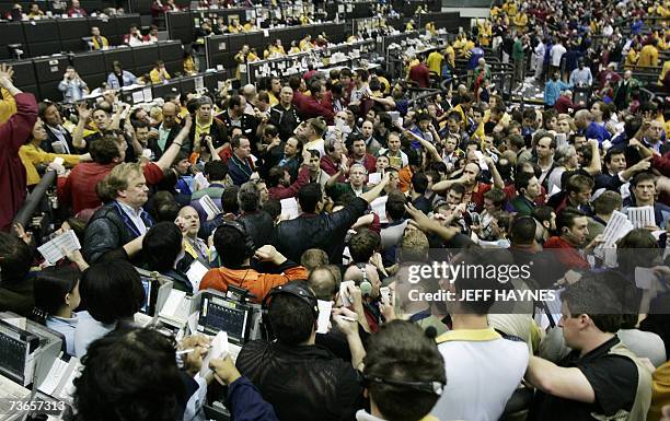 Chicago, UNITED STATES: Traders react in the Euro Dollar pit 21 March, 2007 at the Chicago Mercantile Exchange following the announcement by the US...