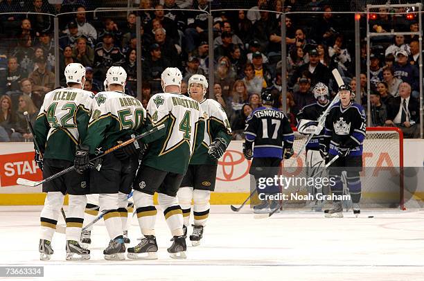 Jon Klemm, Krys Barch and Mattias Norstrom of the Dallas Stars celebrate after a goal against the Los Angeles Kings on March 21, 2007 at the Staples...