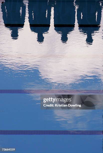 The shadows of competitors are reflected in the pool in the lead up to the Men's Preliminary Round Group C Water Polo match between China and Greece...