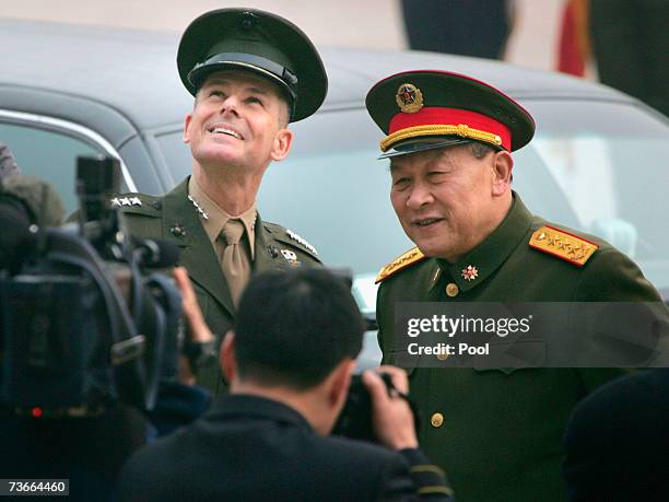 Chairman of the Joint Chiefs of Staff, Marine Gen. Peter Pace and Gen. Liang Guanglie smile during a welcome ceremony at the Defense Ministry in...