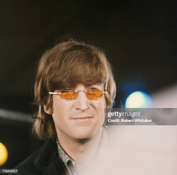 John Lennon of the Beatles during filming of a promotional video for the single 'Paperback Writer' and 'Rain' at Abbey Road, London, April 1966.