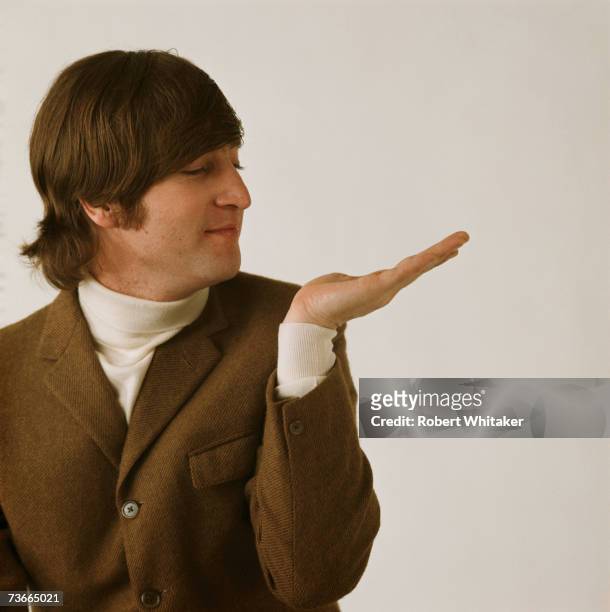 Beatles singer and songwriter John Lennon posing during a studio session in Chelsea, London, March 1966.