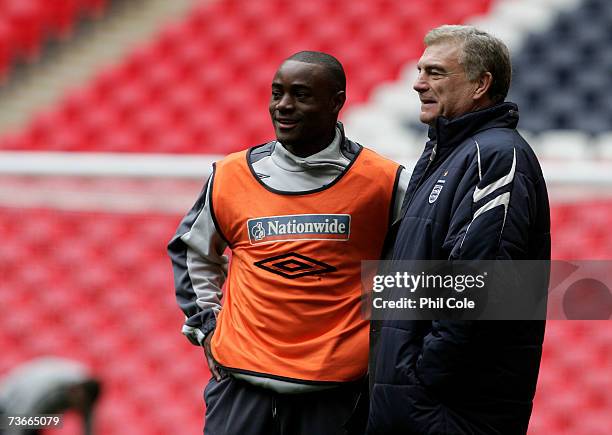 Nigel Reo Coker talks with Trevor Booking during the England U21 training session at Wembley Stadium on March 22, 2007 in London, England.