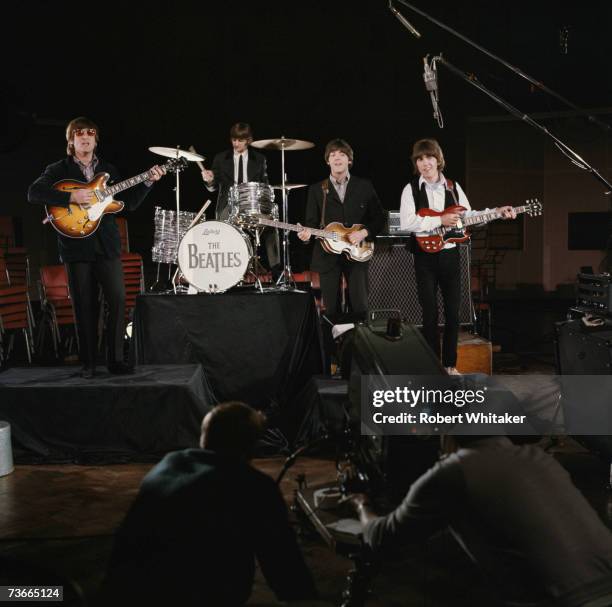 The Beatles John Lennon , Ringo Starr, Paul McCartney and George Harrison being filmed for a promotional video for their single 'Paperback Writer'...