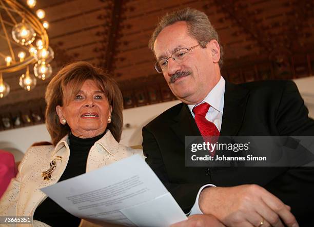 Charlotte Knobloch , president of the central council of Jews in Germany, and Munich Lord Mayor Christian Ude chat prior to the opening ceremony of...