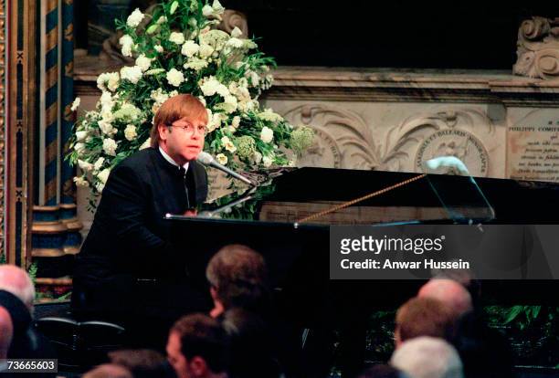 Sir Elton John sings 'Candle in the Wind' at the funeral if Diana, Princess of Wales at Westminster Abbey on September 6, 1997 in London, England.