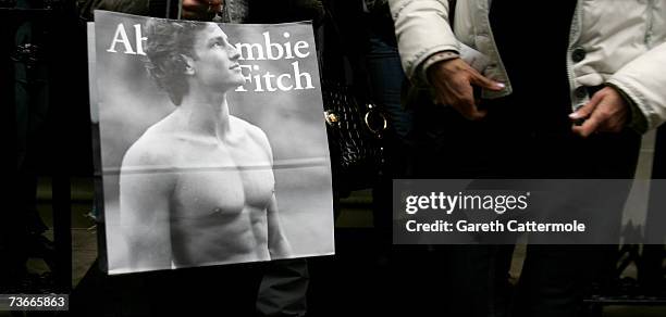 Shoppers leave the Abercrombie & Fitch UK Flagship Store on Savile Row on March 22, 2007 in London, England. The store opened its doors today and is...