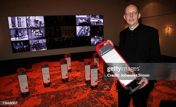 Bernhard Purin, director of the Jewish Museum, poses during the grand opening of the new Jewish museum with exhibition items on March 22 in Munich,...