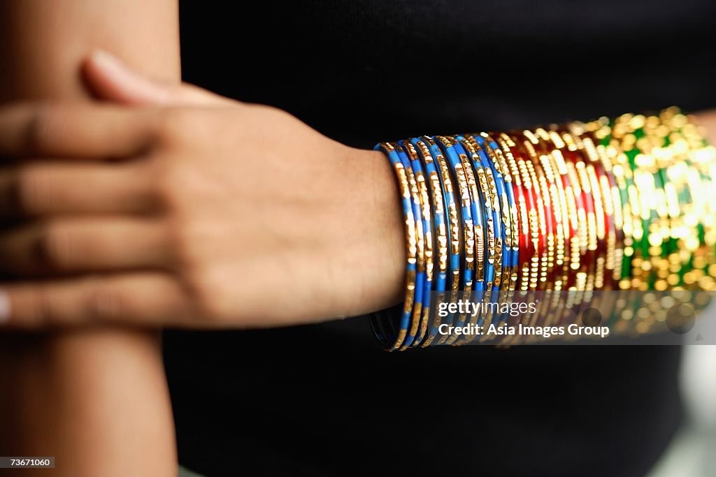 Woman's arm with colourful bangles