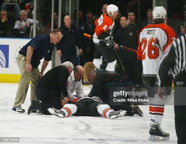 Todd Fedoruk of the Philadelphia Flyers receives medical attention after being knocked out in a fight by Colton Orr of the New York Rangers in the...