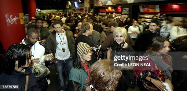 London, UNITED KINGDOM: People queue for the Playstation 3 in the Virgin Megastore, London on the day that Sony launches its new console in Europe,...